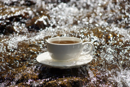 Refreshments and coffee on the rocks at the waterfalls.の写真素材
