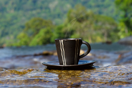 Refreshments and coffee on the rocks at the waterfalls.の写真素材