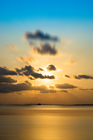 sunset sky over the lake.の写真素材