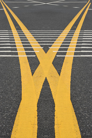 yellow traffic lines on the road.の写真素材