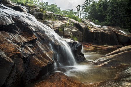Waterfall in tropical forest at Kra Chong national park, Trang province, Thailand.