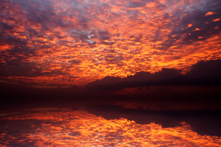 sunset sky with red cloud over the lake, thailand.の写真素材
