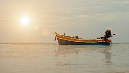 Fishing boats on the quiet sea with sunlight, Thailand.の写真素材