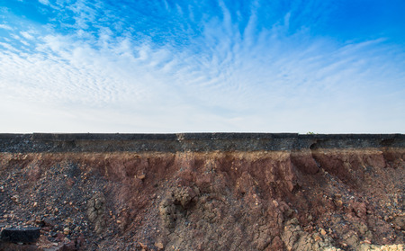 The curb erosion from storms. To indicate the layers of soil and rock.の写真素材