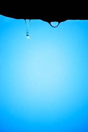 rain drops from shelter in rainy seasonの写真素材