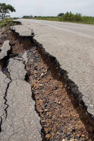 Side of the broken asphalt road collapsed and fallenの写真素材