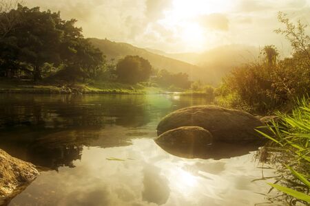 Un-focus image of Brook in the mountains with warm color at Kiriwong village, Nakorn Sri Thammarat., Thailand.の写真素材