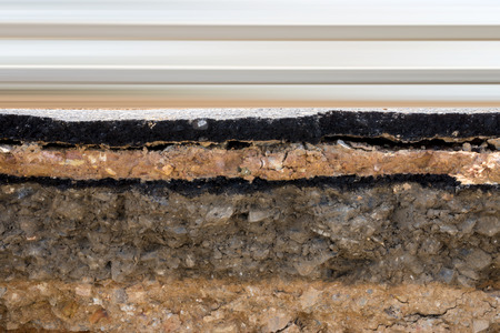 The curb erosion from storms. To indicate the layers of soil and rock.の写真素材