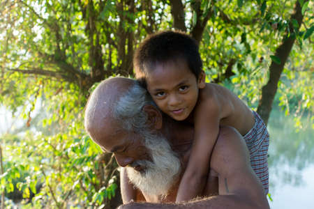 SONGKHLA THAILAND - Mar 3, 2016: Lifestyle grandfather playing with grandchildren on Mar 3, 2016 in Songkhla, Thailand.のeditorial素材