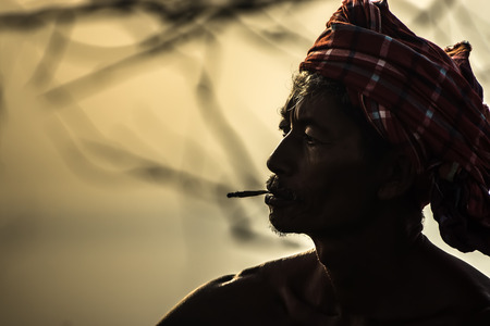 PHATTHALUNG THAILAND - July 26, 2015: Lifestyle Fishermen are smoking on July 26, 2015 in Phatthalung, Thailand.のeditorial素材