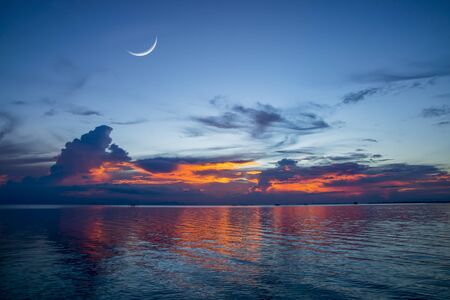 Sunset sky on the lake in south of Thailand., un-focus image.の写真素材
