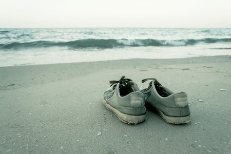 shoes on the beach in vintage color.の写真素材