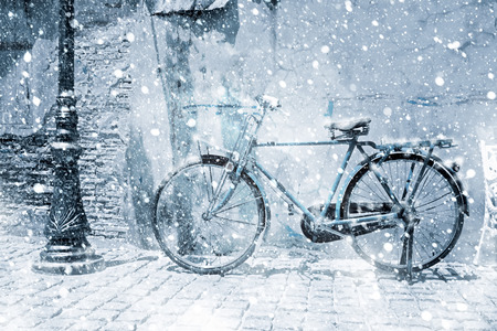 Vintage bicycle in the winter with snow.の写真素材