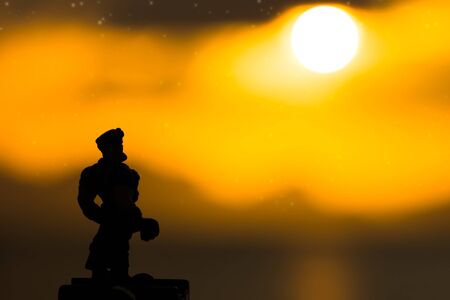 Silhouettes of muscle at sunset.の写真素材