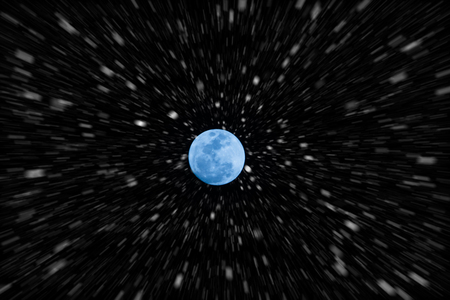 Motion snow fall in night sky and blue full moon.の写真素材