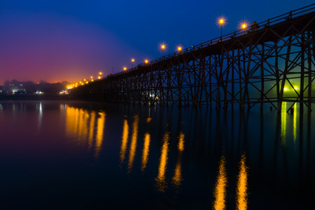 Sangkhlaburi wooded bridge over the river before sunrise Karnjanaburi. Thailand.の写真素材