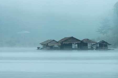 Resort in the lake with mist background at Karnjanaburi, Thailandの写真素材