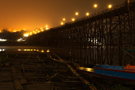 Sangkhlaburi wooded bridge over the river before sunrise Karnjanaburi. Thailand.の写真素材
