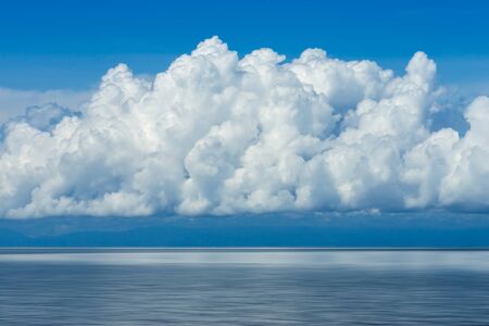 White cloud over the lake with blue sky.