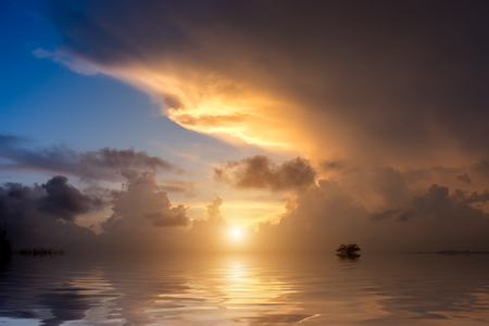 sunrise sky on the lake with big cloud.の写真素材