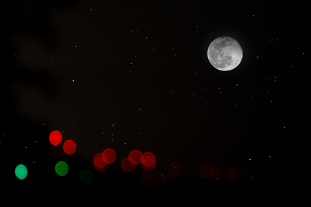 Minimal color bokeh in the dark background with full moon and star.の写真素材