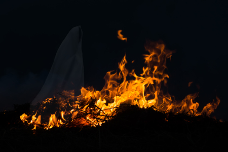 Ghost in the movement of the flames in the dark background.の写真素材