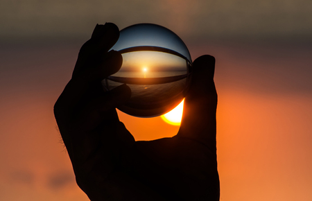 Crystal in hand at sunset.の写真素材