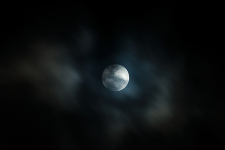 The full moon in the dark night with motion cloud.の写真素材