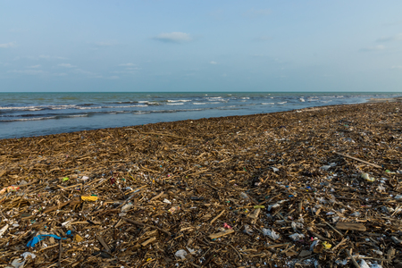 The dirty sea is full of rubbish.の写真素材