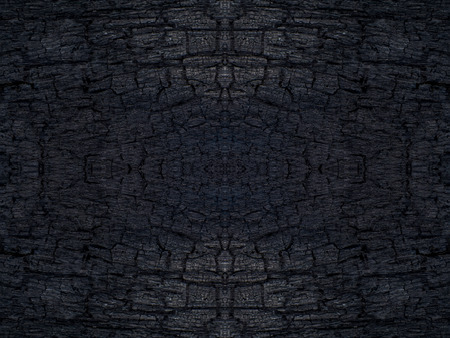 Low key image the Surface of charcoal background. This image is not in focus.