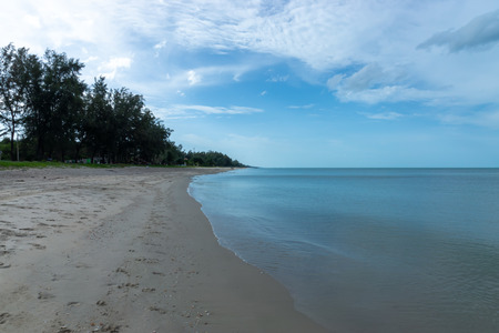 Nobody on the beach with blue sky and clouds in summer season.