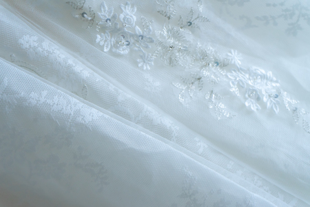 Close up Soft focus of delicate white wedding dress background.の写真素材