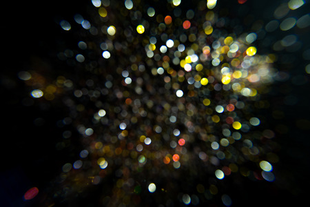 Multi color sparkling bokeh background with light.の写真素材