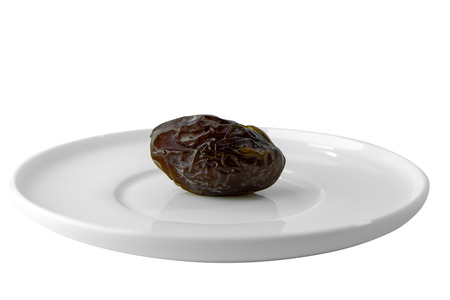 Close up a Medjool Date Palm fruit isolate on white background with clipping path. (Scientific name Phoenix dactylifera)の写真素材