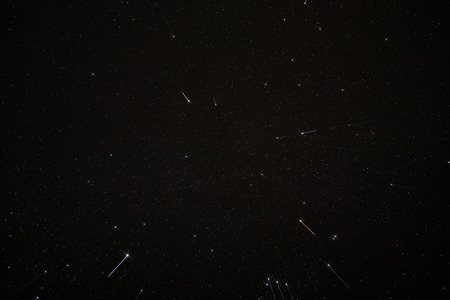 The sky and motion stars in the dark night with noise and grain.