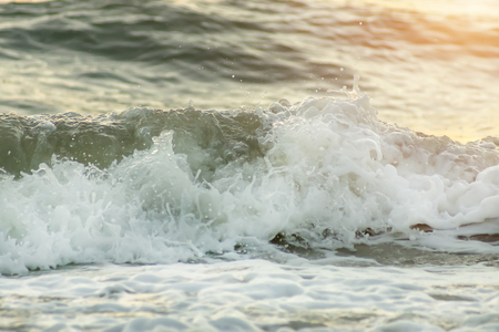 Soft wave on the beach with sunlight.の写真素材