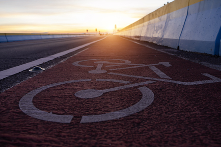 Abstract Bicycle icon on the road with sunlight.の写真素材