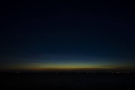 The sky with star at the lake in the twilight after sunset.の写真素材