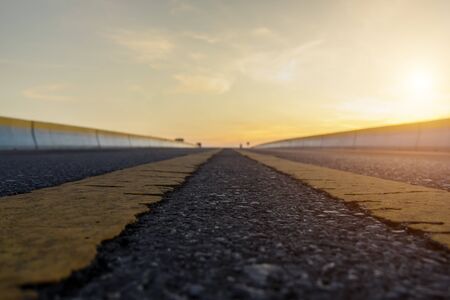 Empty road and the traffic lines with sunlight.の写真素材