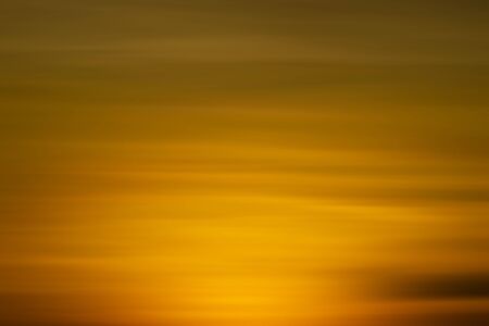 Orange sky and soft cloud in sunset sky backgroundの写真素材