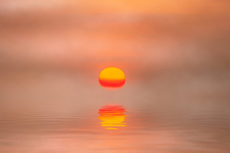 Sunset reflection at the lake with soft mist.の写真素材