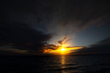 Low key image, sunset sky before the twilight into the dark night.の写真素材