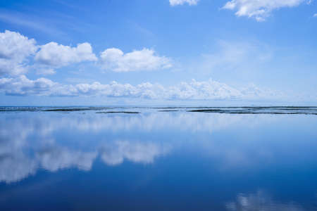 beautiful cloudy sky over an empty lake.の写真素材