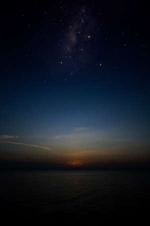 Vertical seascape image, The twilight sky with stars at the lake.の写真素材