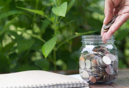 The hand that is gradually coin-operated for saving money to use when retiring. The image selects to...