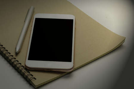 Smartphone Abstract on Notebook, Selective focus.