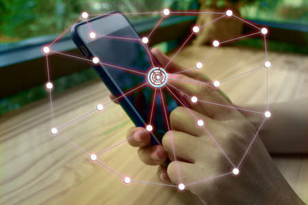 Women are using smartphones to communicate with mixed media.の写真素材