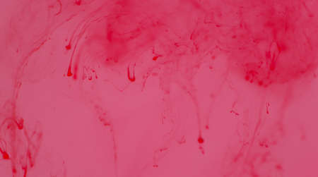 Color ink broken from dripping into water, abstract concept, background image.