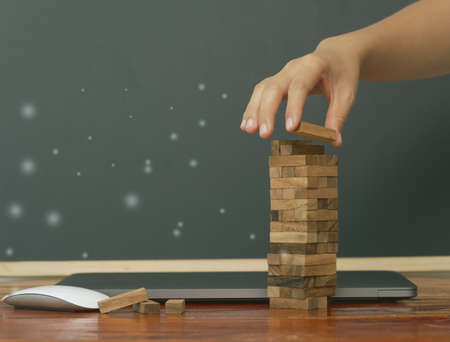 Abstract stacked wooden boxes that inspire corporate development, economic growth, organizational fulfillment, and a Better tendency to achieve goalsの写真素材