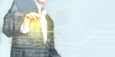 Businessman pointing out the concept of business planning to achieve corporate goals abstract mixed media.の写真素材